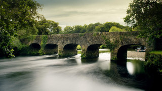 Stone bridge river man bench - anne rigney free wallpaper