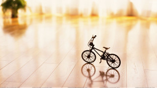 Toy bike wooden floor room - tilt shift free wallpaper
