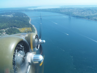 Propeller plane flying water bridge - a propeller plane free wallpaper