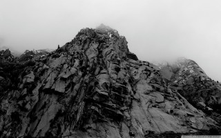 Mountain peak clouds rocks black - a few rock below free wallpaper