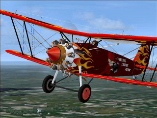 Red white biplane cityscape sky - digital free wallpaper