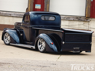 Black truck parked road building - the side of a road next free wallpaper