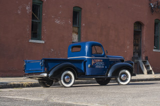 Blue truck parked road building - the side of a road next free wallpaper