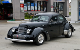 Black car parked road building 4 - the side of the road in front free wallpaper