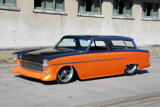 Orange black car parked building - car free wallpaper