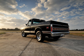 Black truck runway cloudy sky - under free wallpaper