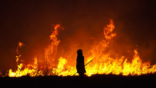 Person standing fire stick flames - a person free wallpaper