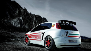 Small white car red green - side and a mountain in the background free wallpaper