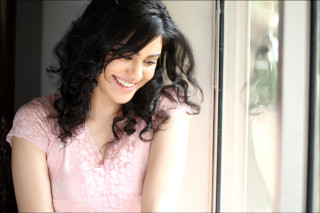 Woman pink dress smiling window - a pink dress free wallpaper