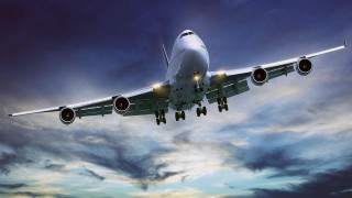 Jetliner cloudy sky dusk lights - a cloudy sky free wallpaper