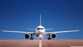 Large jetliner blue sky desert - turnaround free wallpaper