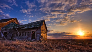 Dilapidated building sunset field cloudy - scene free wallpaper