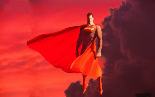 Woman red orange dress flying - a red cape free wallpaper
