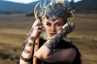 Woman horned headdress holding stick - headdress free wallpaper