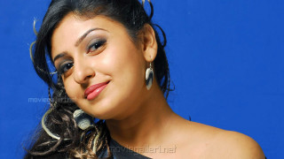 Woman earrings blue background backdrop - movie still frame free wallpaper