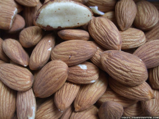 Almonds pile piece top side - food photography free wallpaper
