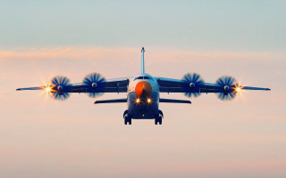 Jetliner flying cloudy sky lights - a cloudy sky free wallpaper