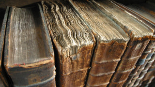 Old books wooden table pile - a flemish baroque free wallpaper