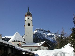 Church steeple clocktower snow mountains - a church free wallpaper