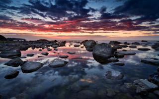 Sunset rocky beach clouds saturated - a sunset over a rocky beach free wallpaper
