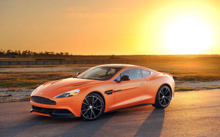Orange sports car sunset desert - the sun behind free wallpaper