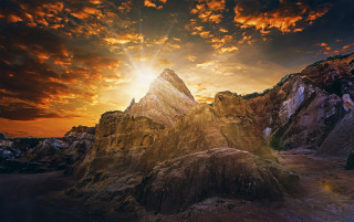 Mountain sunset clouds sky beautiful - a sun setting behind free wallpaper