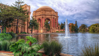 Large building fountain sky clouds - a large building free wallpaper