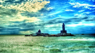 Large body of water lighthouse - cloudy free wallpaper