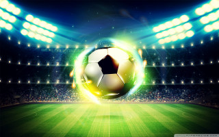 Soccer ball flying stadium field - a soccer ball free wallpaper