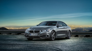 Silver car parked city skyline - constant permeke free wallpaper