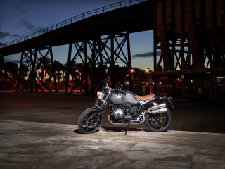 Motorcycle parked bridge night sky - a sky background and a bridge in the background free wallpaper