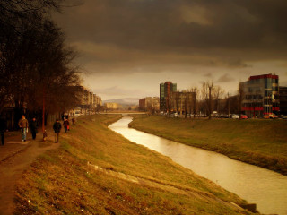 People walking path river city - a dark sky free wallpaper