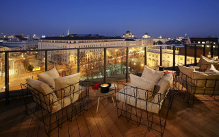 Balcony chairs tables city night - a balcony free wallpaper