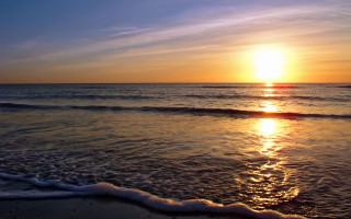 Sunset ocean waves beach person 12 - the beach in the distance free wallpaper