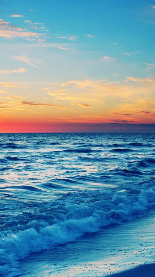 Sunset ocean beach waves crashing - a sunset over the ocean free wallpaper