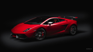 Red sports car dark room - a red sports car free wallpaper