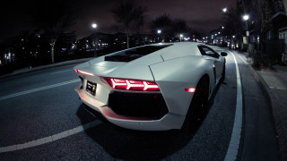 White sports car night parked - the side of the road free wallpaper
