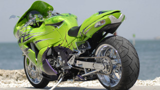 Green motorcycle beach water rocks - a green motorcycle free wallpaper