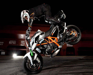 Person motorcycle trick air night - a trick in the air free wallpaper