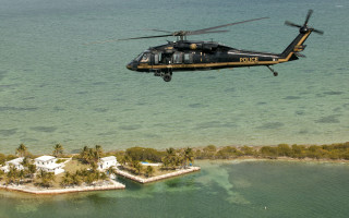 Helicopter flying small island ocean - a helicopter free wallpaper