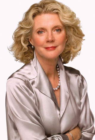 Blonde woman silver jacket pearls - her neck free wallpaper