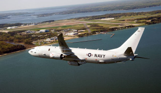 Navy plane flying water town - aerial free wallpaper