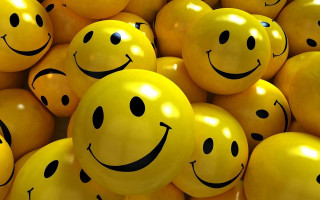 Yellow balloons smiley faces pile 2 - cheerful free wallpaper