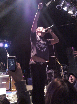 Man holding microphone stage audience - a stage free wallpaper