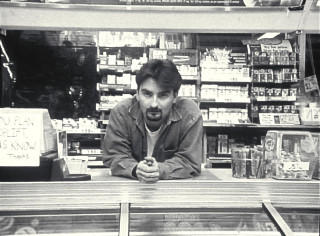 Man sitting counter store cell - david begbie free wallpaper