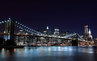 City skyline night bridge river - a bridge and a river in front free wallpaper
