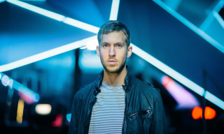 Man black jacket blue lights - facial feature free wallpaper