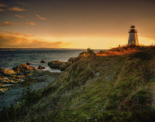 Lighthouse cliff ocean sunset sunrise - radiant free wallpaper