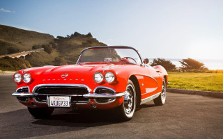 Red classic car grassy hill - kodachrome free wallpaper