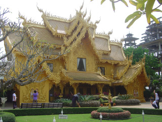 Yellow building people standing tree - a yellow building free wallpaper